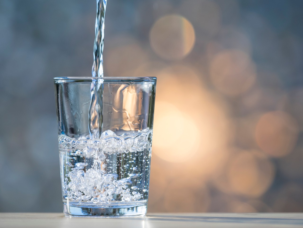 Pouring water into glass