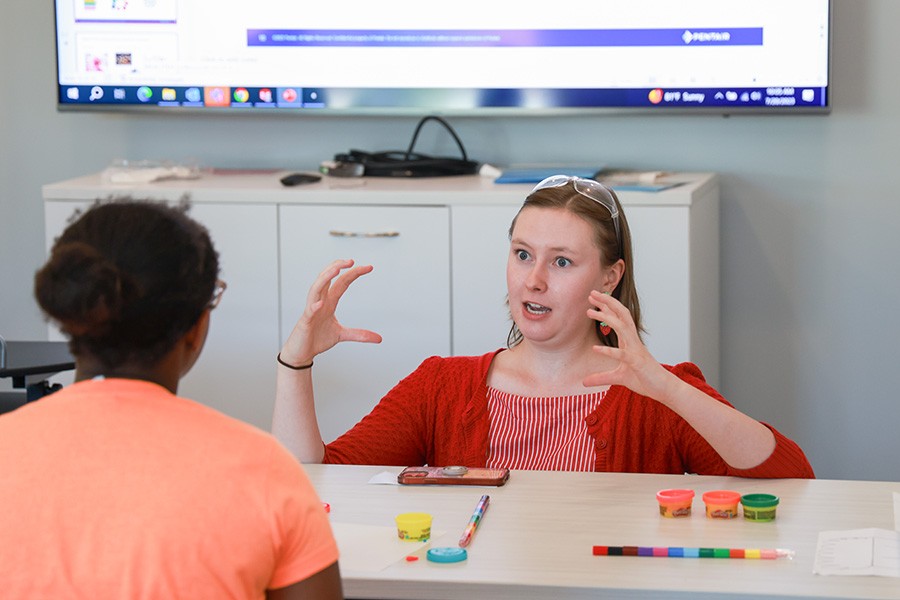 Junior Achievement Water Shop photo of Pentair employee teaching a young girl